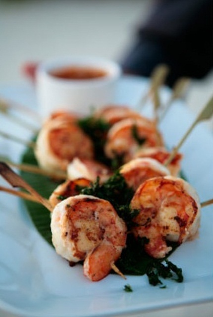 grilled shrimps on skewers with fresh greenery will be loved by most of guests, they are delicious