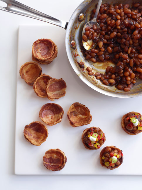 bacon cups fileld with beans, pepper and greenery on top