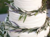 a white textural buttercream wedding cake decorated with greenery and lavender is a lovely idea for a Provence or vineyard wedding