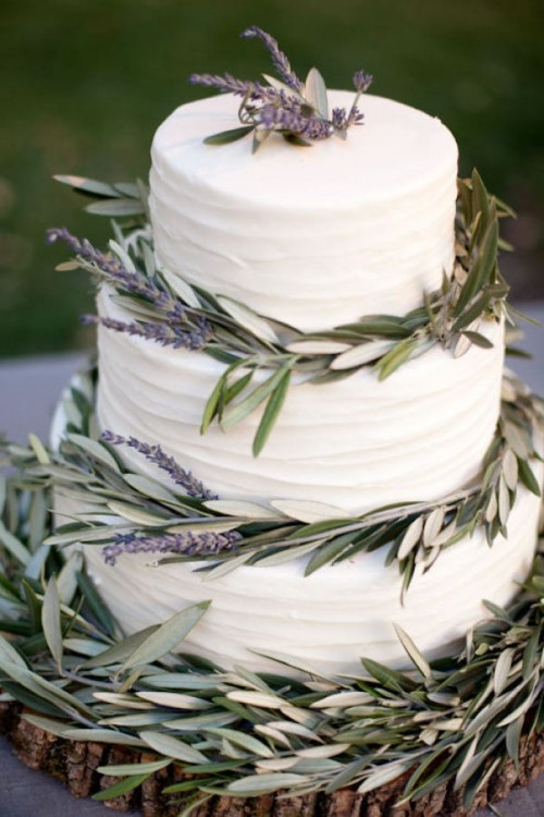 a white textural buttercream wedding cake decorated with greenery and lavender is a lovely idea for a Provence or vineyard wedding