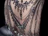a black velvet wedding dress with multiple back necklaces to make a stylish statement