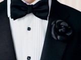 a black tux with a black fabric flower boutonniere for a soft gothic groom