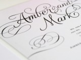 elegant white wedding stationery with black calligraphy for a soft gothic wedding