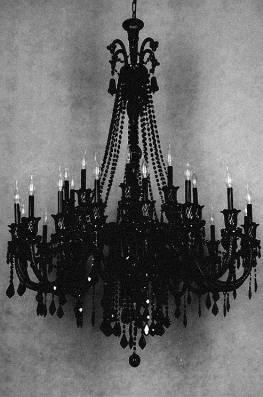 A bold black chandelier with bulbs is a gorgeous idea for a soft gothic wedding