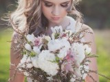 a pale boho wedding bouquet in white, pink and with some grasses is a cool idea for a summer or spring boho bride