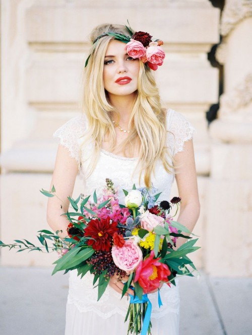 a colorful wedding bouquet in burgundy, red, white, pink, with berries, thistles and greenery is awesome for a summer bride