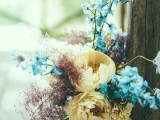 a pastel wedding bouquet in powder blue, pink, muted yellow looks very unusual and fits a spring boho bride