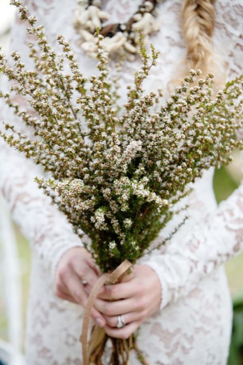 a boho spring wedding bouquet of blooming branches is a nice solution for a spring boho bride
