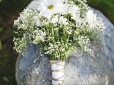 a wild bouquet of baby’s breath and white camomiles is a nice idea for a spring or summer bride