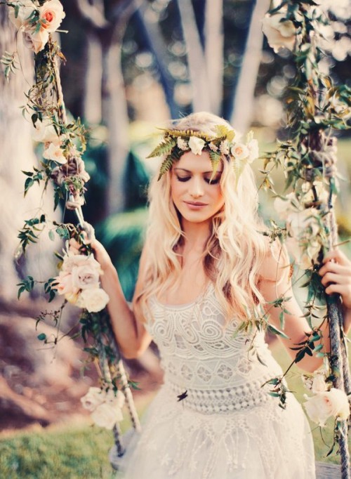 a boho woodland bride wearing a boho lace A-line wedding dress, a fern and neural bloom crown looks very chic and very naturally beautiful