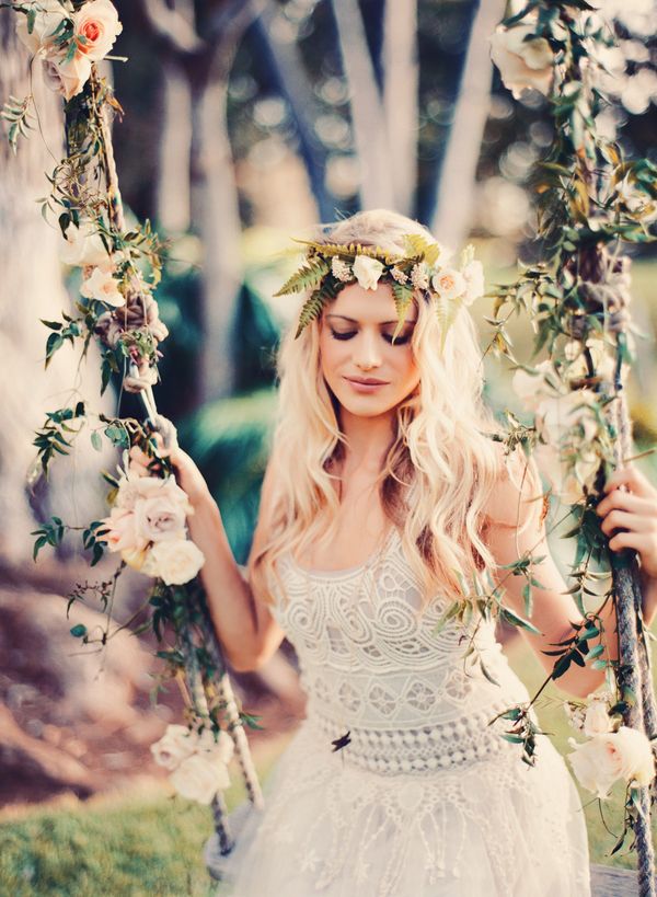 A boho woodland bride wearing a boho lace A line wedding dress, a fern and neural bloom crown looks very chic and very naturally beautiful