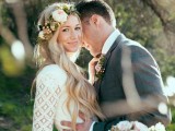 a boho woodland bride wearing a boho lace sheath wedding dress and a beautiful neutral floral crown