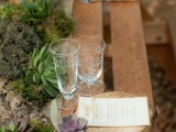 a woodland wedding table runner made of driftwood, moss, rocks and succulents is ideal for a woodland space