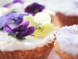 delicious summer wedding cupcakes topped with purple and lemon pansies are a lovely idea for a spring or summer wedding