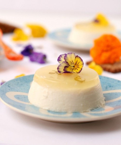 panna cotta with fresh fruit jelly on top and pansies is a lovely and chic idea for a summer wedding