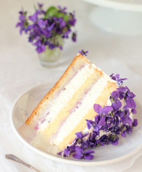 a wedding cake slice topped with fresh rosemary blooms is a gorgeous idea for a garden wedding
