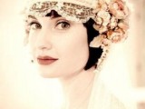 a vintage lace headband with embellishments and dried blooms and leaves and a veil for a vintage bride