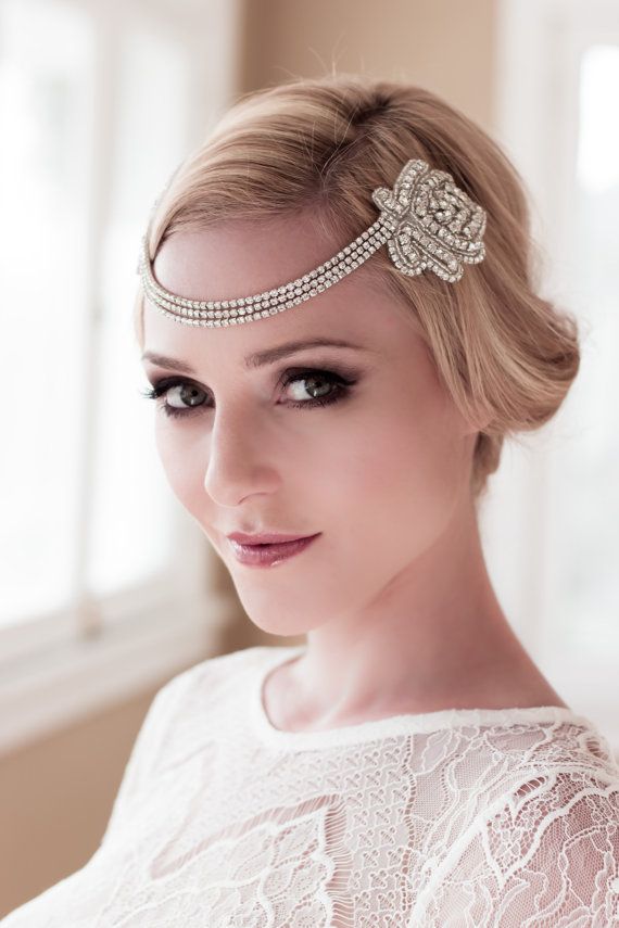 An embellished art decor bridal headpiece with rows of rhinestones will be an amazing addition to an art deco bridal look