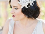 a statement embellished one side bridal headpiece with pearls and rhinestones is a beautiful and refined idea