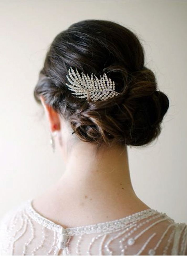 A feather shaped rhinestone headpiece will be a gorgeous idea for an art deco or glam vintage bride