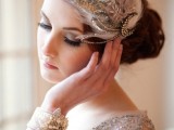 an embellished feather art deco headpiece with a half moon is a statement idea for an art deco bride
