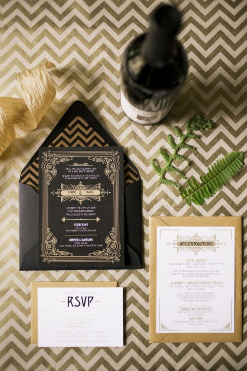 a black, white and gold wedding invitation suite with an elegant chevron print