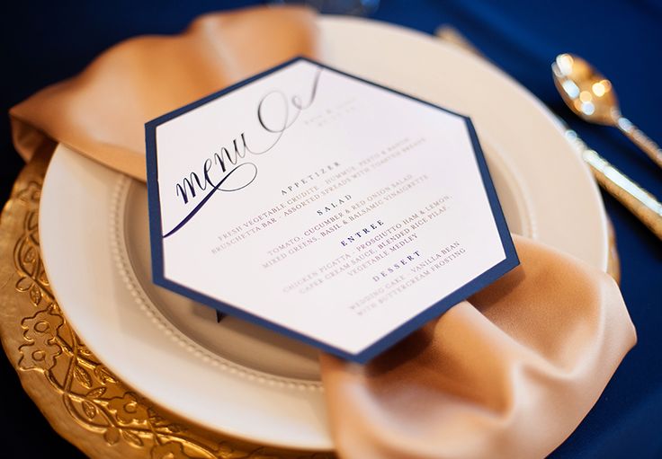 A chic navy, gold, white and blush place setting