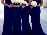 navy strapless and one shoulder maxi mermaid bridesmaid dresses with white bouquets