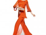 an orange suit – a top with long sleeves and a draped neckline and flowy pants plus an elegant clutch and gold shoes to make a statement with color