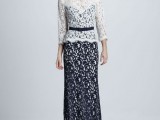 a stylish mother of the bride look with a white lace long sleeve top over a navy lace fitting maxi dress