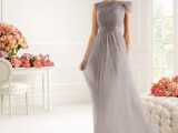an airy grey draped A-line maxi dress with a single cap sleeve and silver shoes for a very elegant a chic mother of the bride look