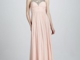 a blush sleeveless a-line maxi dress with a silver sequin bodice and a pleated skirt is a refined and chic idea for a mother of the bride