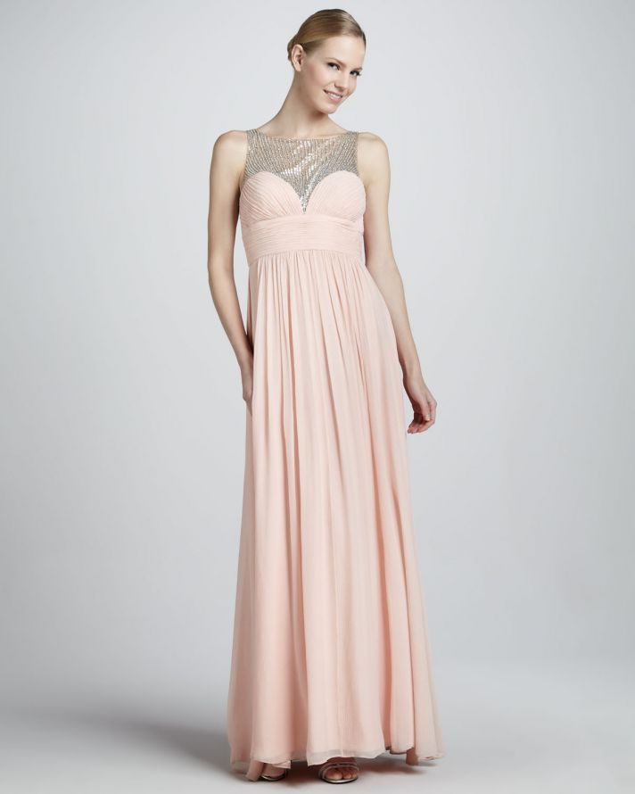 A blush sleeveless a line maxi dress with a silver sequin bodice and a pleated skirt is a refined and chic idea for a mother of the bride