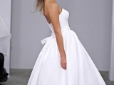 a chic strapless A-line tea length wedding dress with statement earrings for a sexy vintage look at the wedding