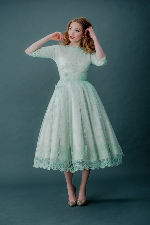 a mint green tea length lace A-line wedding dress with short sleeves, a high neckline and grey vintage shoes just wows