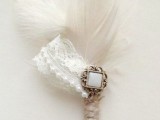 a vintage wedding boutonniere of feathers, lace, a vintage brooch and twine is a stylish accessory you can make