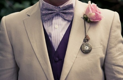 a vintage pocket watch and a pink rose is a stylish and eye-catchy accessory for a vintage groom's look