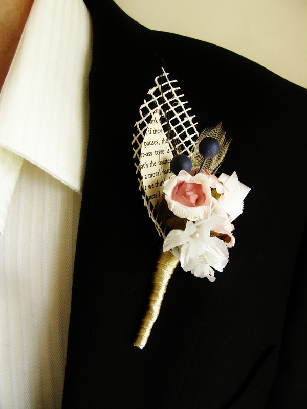 a vintage wedding boutonniere of fabric blooms, paper and mesh leaves and faux berries is a stylish vintage accessory for a wedding