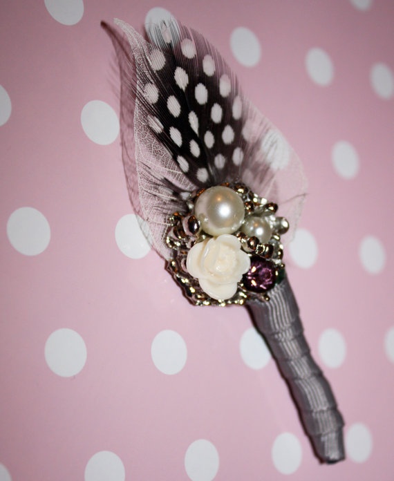 a vintage wedding boutonniere of a feather, pearls and beads and a grey ribbon wrap is a stylish idea for a vintage wedding
