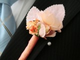 a paper and fabric flower boutonniere with leaves and a ribbon wrap is a simple solution that can be DIYed anytime