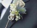 a beautiful vintage wedding boutonniere with berries, pale foliage, a thistle piece and a vintage key is a lovely accessory to highlight your style