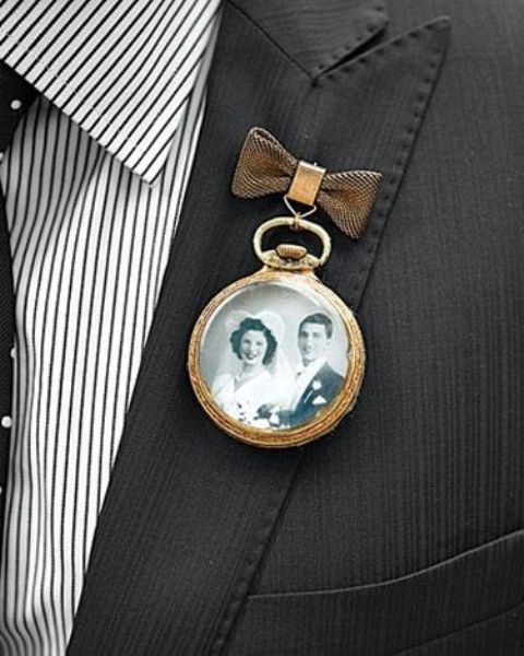 a vintage wedding boutonniere of a pocket watch with a vintage photo and a little bow is a unique solution for a vintage groom's look