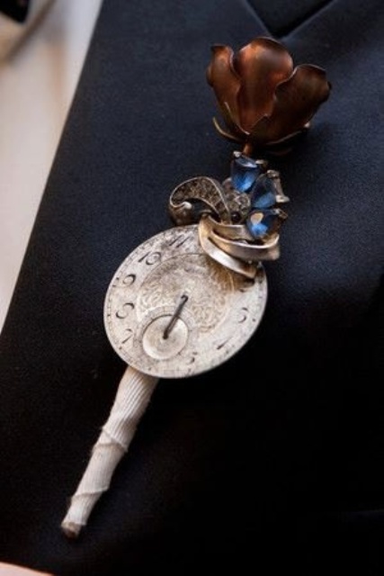 a vintage clock face with swirls and beads, a metal flower and a wrap is a creative idea with plenty of chic