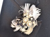 a lovely vintage wedding boutonniere of vintage brooches, feathers and a black ribbon is a lovely idea for a vintage groom’s look