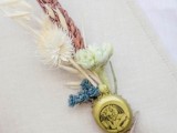 a unique vintage wedding boutonniere of colorful dried blooms and a bottle lid plus twine is a lovely vintage accessory for a wedding