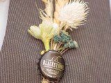 a vintage boho wedidng boutonniere of dried blooms and grasses and a bottle lid is a fun and cool piece that you can easily DIY