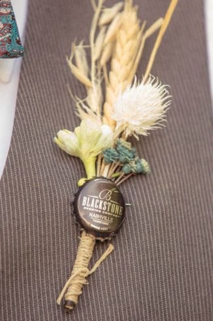 a vintage boho wedidng boutonniere of dried blooms and grasses and a bottle lid is a fun and cool piece that you can easily DIY