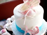 a beach bridal shower cake with seashells, starfish made of sugar looks very cool and very stylish