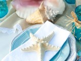 top your place settings with starfish and put seashells on the table to create a strong beach and seaside feel