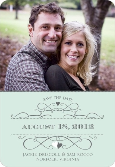 a colored couple's photo as a base for a save the date magnet, with a green lower part where you can read the date